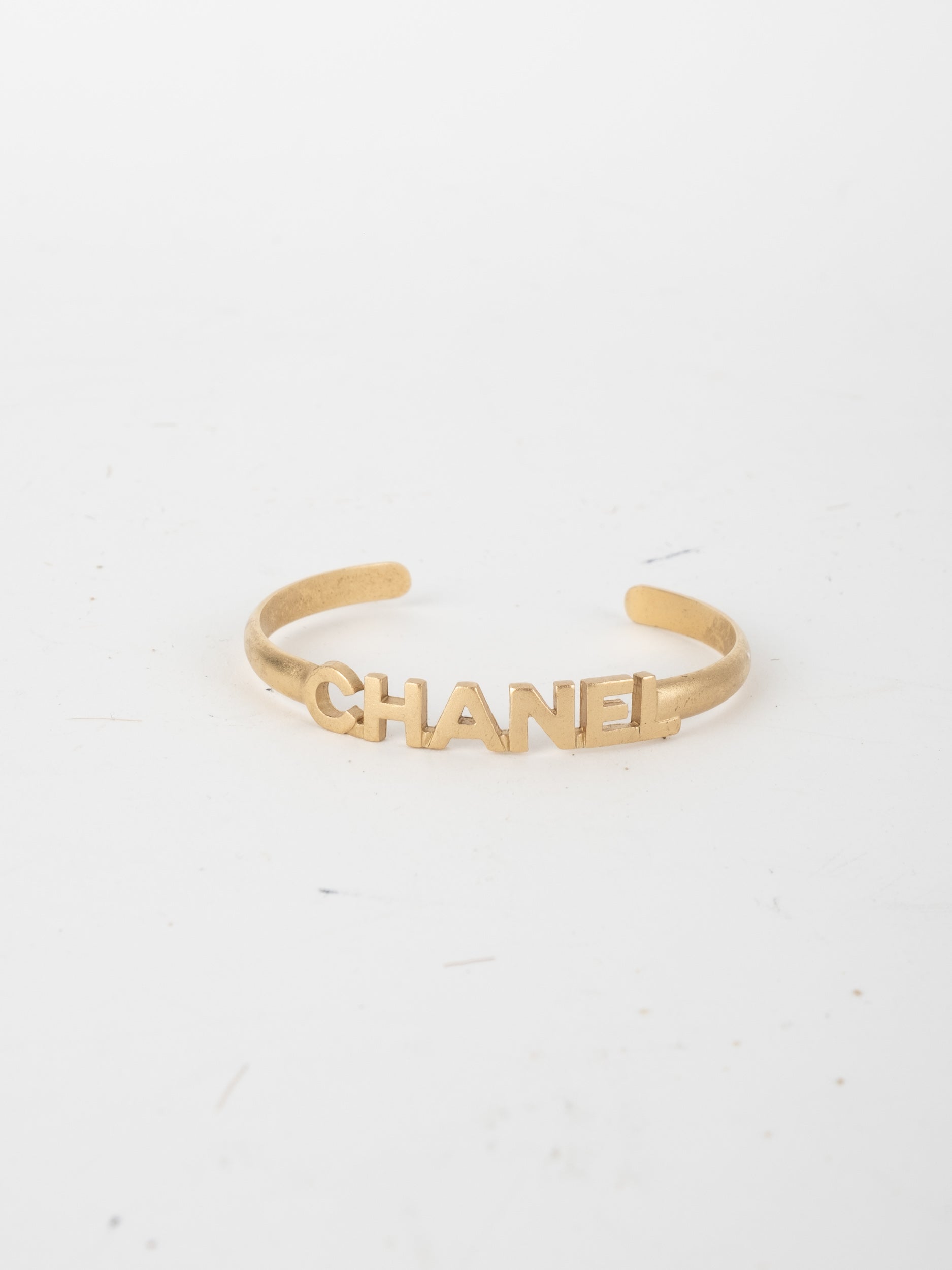 CHANEL Vintage Logo Cuff Bracelet Gold