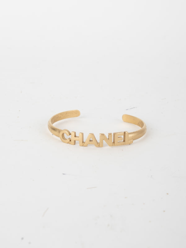 CHANEL Vintage Logo Cuff Bracelet Gold