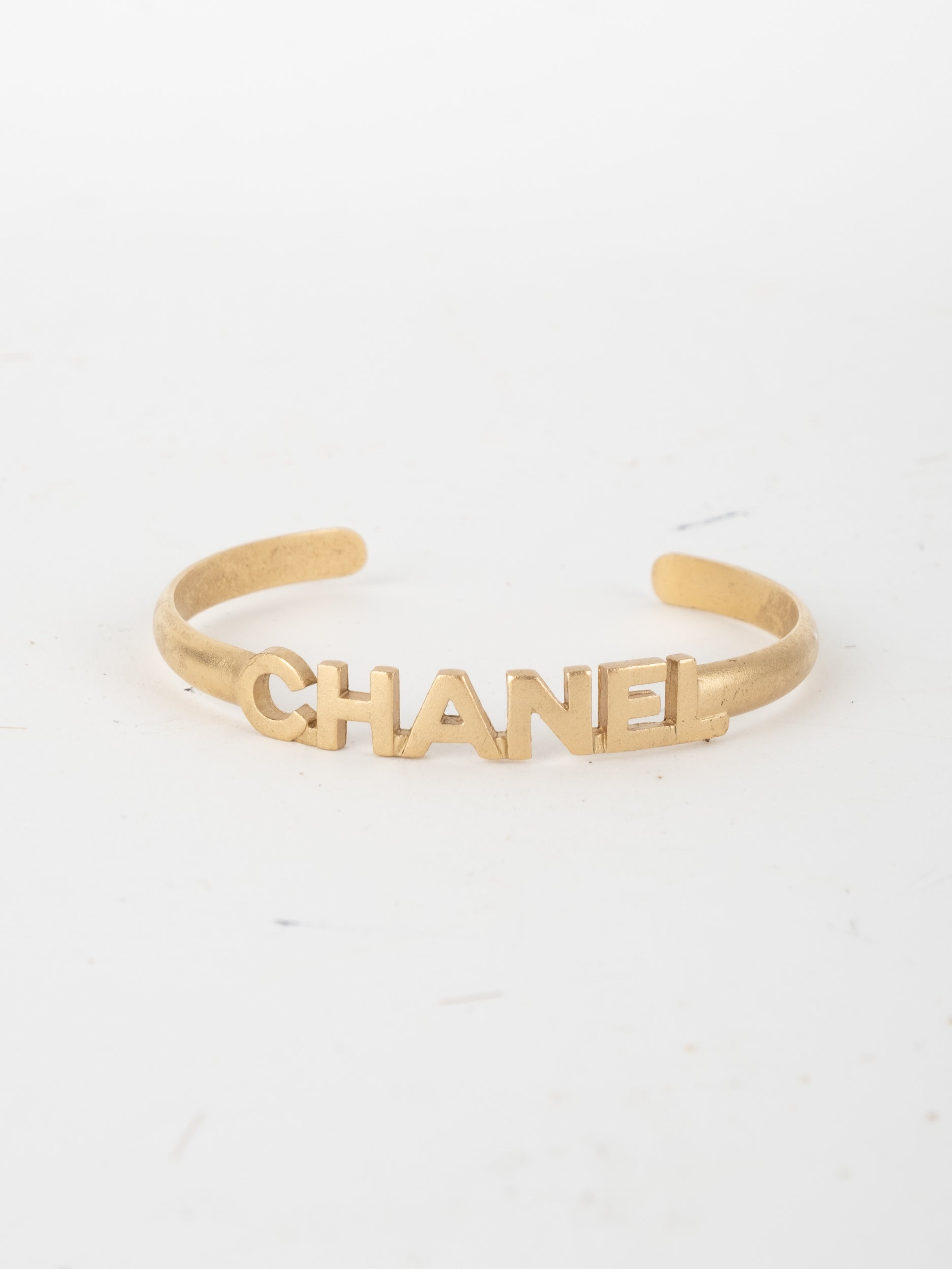 CHANEL Vintage Logo Cuff Bracelet Gold